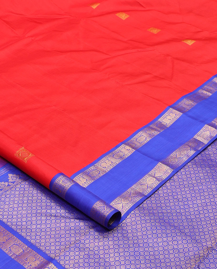 Red zari buttas Kanchipuram silk saree, contrast rettai pettu border of rekku, muthu, diamond, and annam chakram designs, and intricate pallu