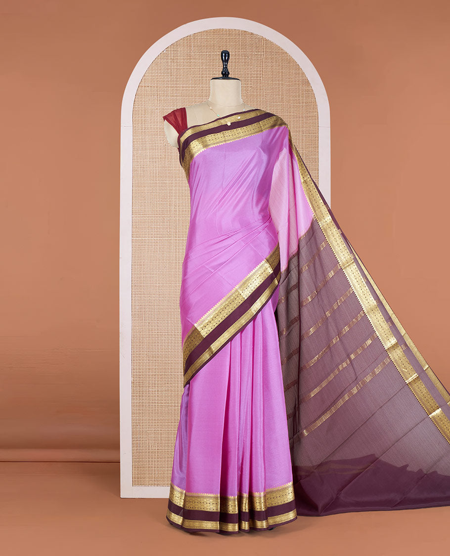 Pink Plain Mysore Silk Saree, Complemented by a Contrast Rettai Pettu Border of Traditional Zari Designs, a Simply Sparkled Pallu of Zari Stripes, and a Contrast Blouse