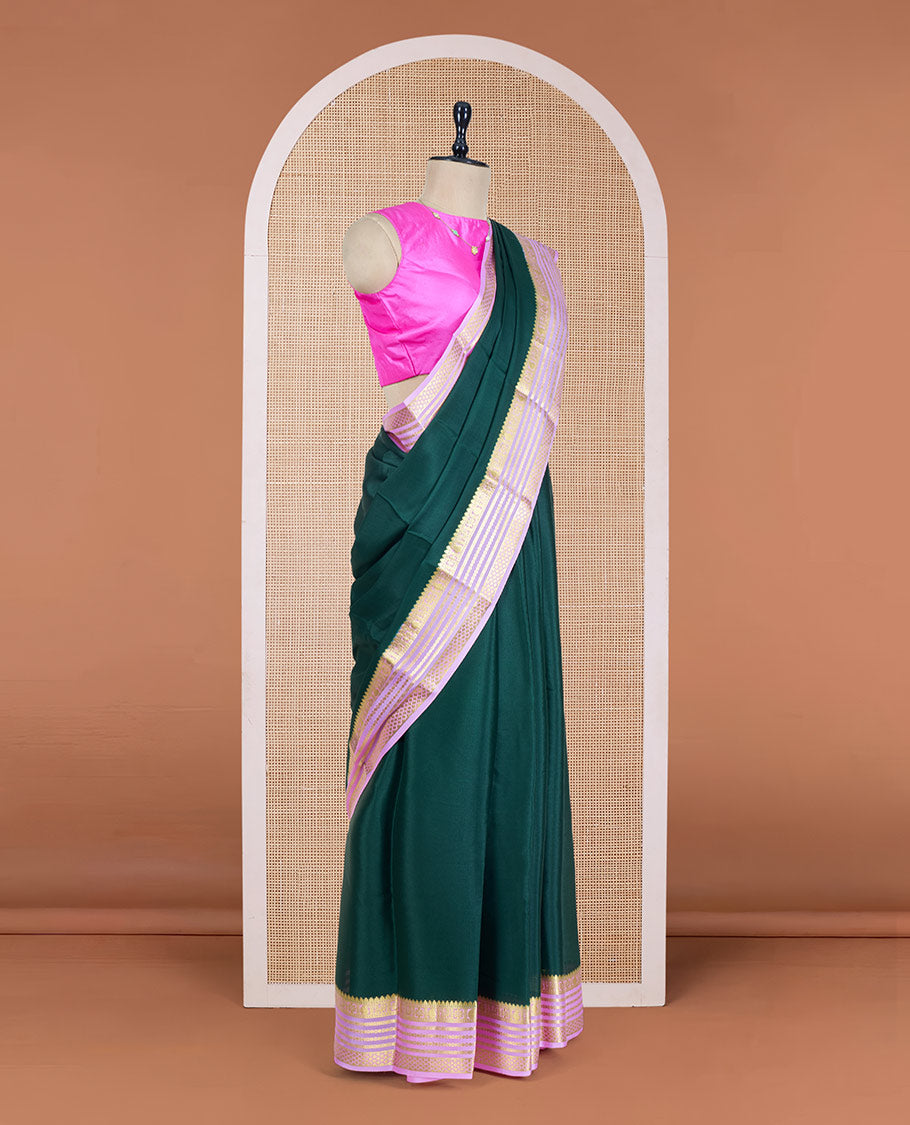 Green Plain Mysore Silk Saree, Complemented by a Contrast Varisai Pettu Border of Traditional Zari Designs, a Subtly Sparkled Pallu of Zari Stripes, and a Contrast Blouse