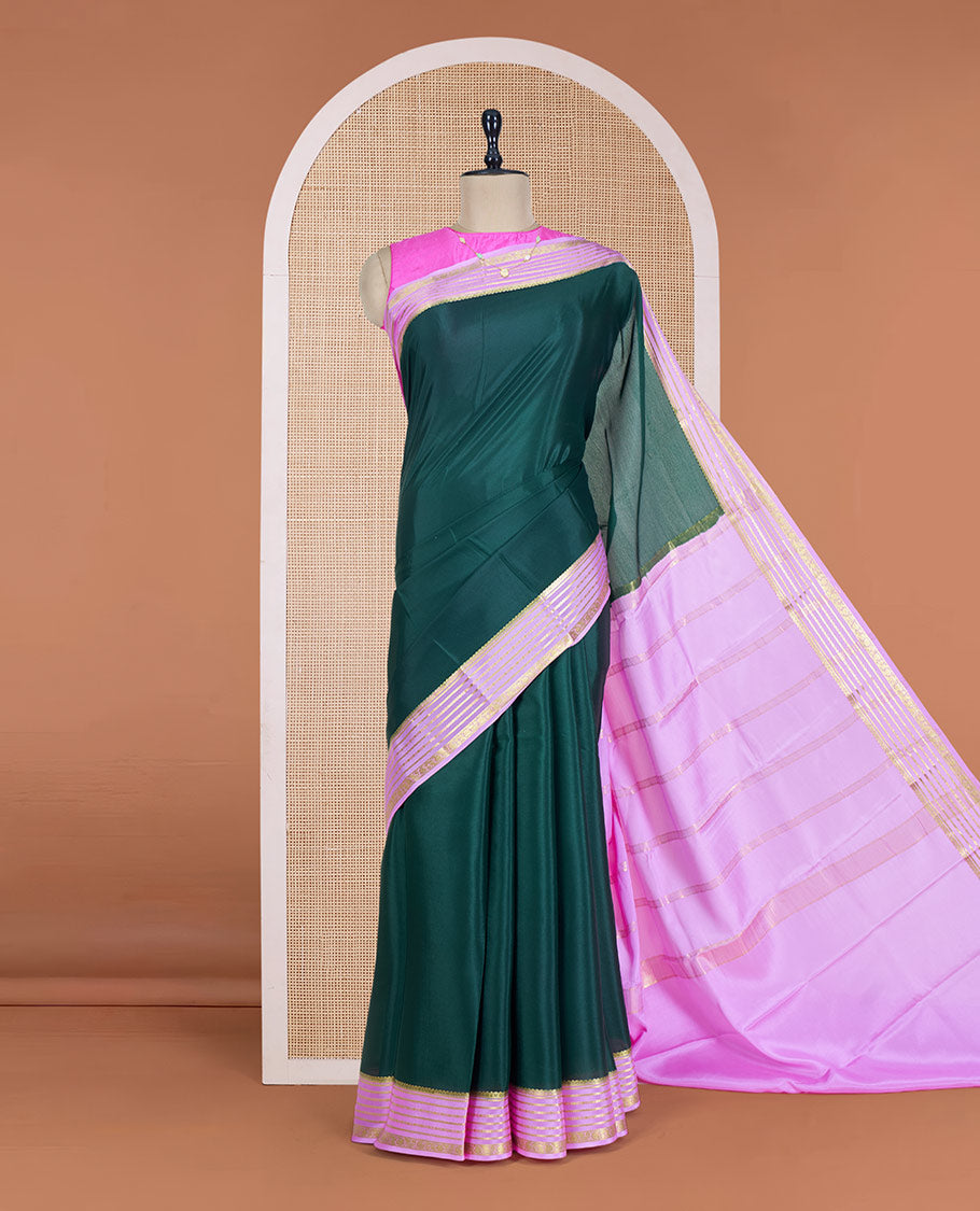 Green Plain Mysore Silk Saree, Delicately Woven by a Contrast Varisai Pettu Border of Traditional Zari Designs, a Subtly Sparkled Pallu of Zari Stripes, and a Contrast Blouse