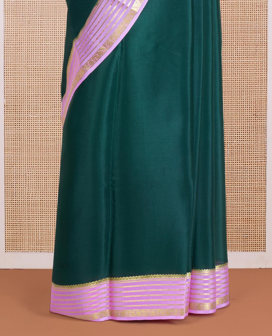 Green Plain Mysore Silk Saree, Delicately Woven by a Contrast Varisai Pettu Border of Traditional Zari Designs, a Subtly Sparkled Pallu of Zari Stripes, and a Contrast Blouse