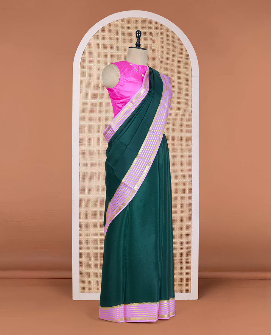 Green Plain Mysore Silk Saree, Delicately Woven by a Contrast Varisai Pettu Border of Traditional Zari Designs, a Subtly Sparkled Pallu of Zari Stripes, and a Contrast Blouse