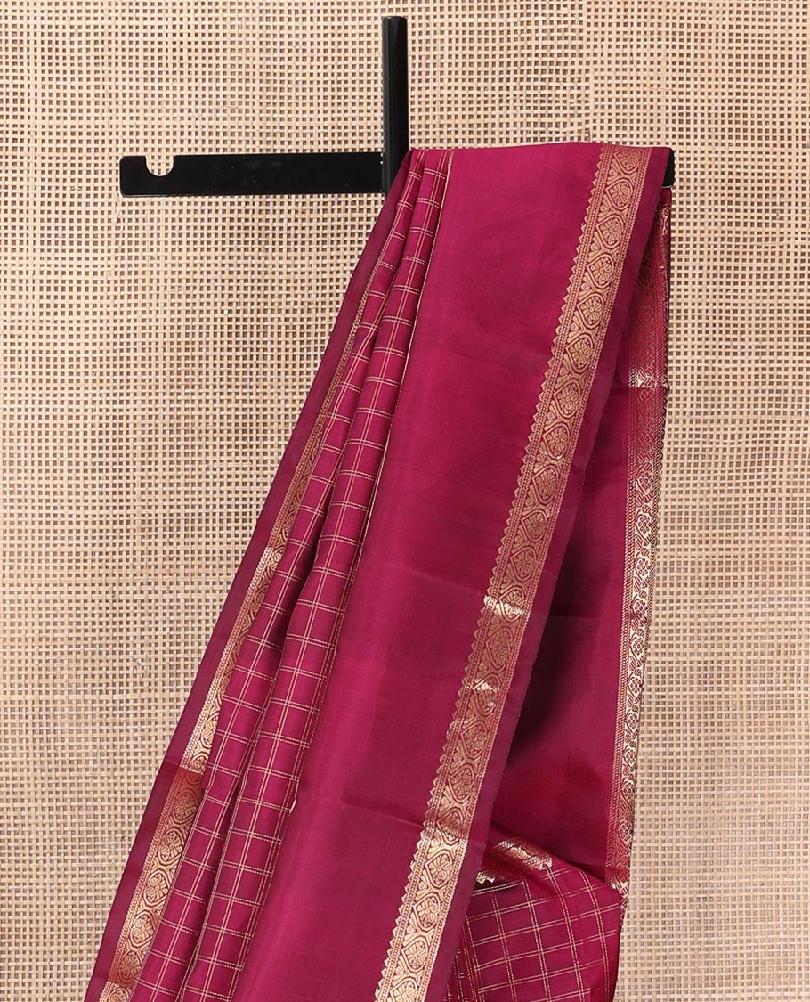 Red checked Kanchipuram silk saree, rettai pettu border of rekku, and jada nagam, and pallu of manga mokku, annam chakram, and Navagunjara designs