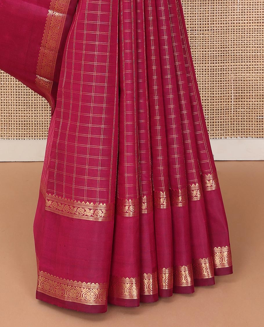 Red checked Kanchipuram silk saree, rettai pettu border of rekku, and jada nagam, and pallu of manga mokku, annam chakram, and Navagunjara designs