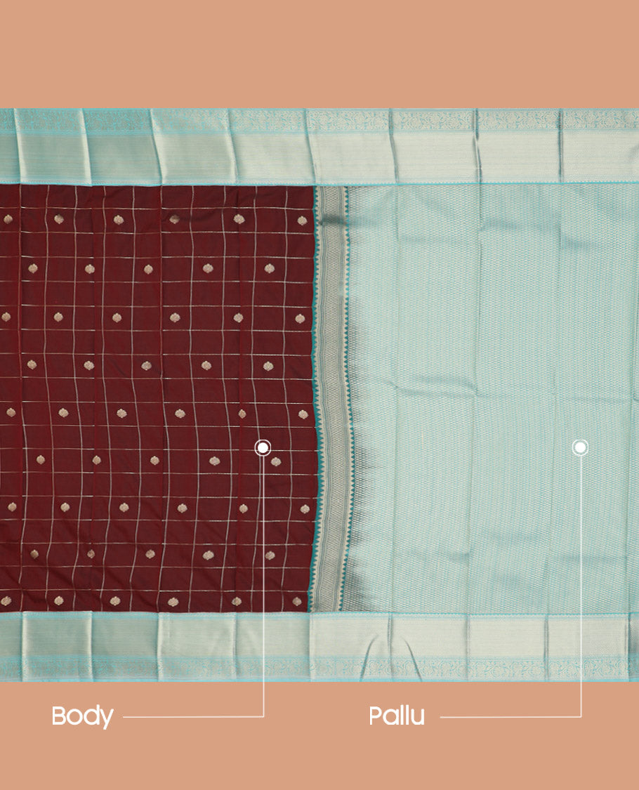 Maroon Budget Silk Saree Richly Detailed with Zari Butta Enclosed Checks, Complemented by a Contrast Traditional Zari Design Border, Subtly Designed Jaal Pallu, and Paired with a Contrast Blouse