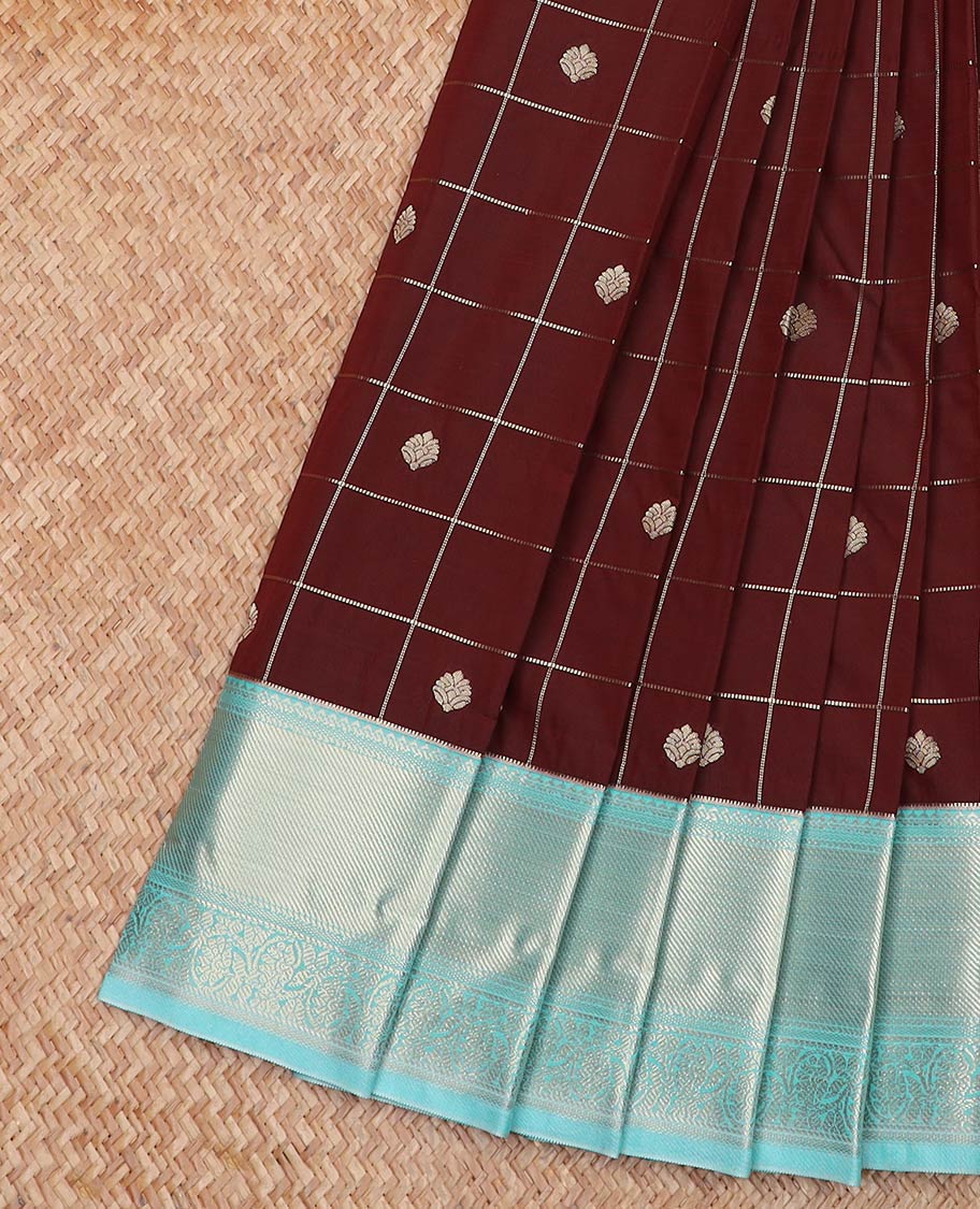Maroon Budget Silk Saree Richly Detailed with Zari Butta Enclosed Checks, Complemented by a Contrast Traditional Zari Design Border, Subtly Designed Jaal Pallu, and Paired with a Contrast Blouse