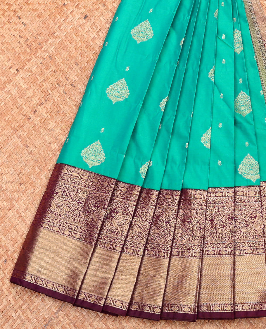 Green Budget Silk Saree, Adorned with Buttas, Complemented by a Contrast Traditional Zari Border, Grand Pallu, and Contrast Blouse