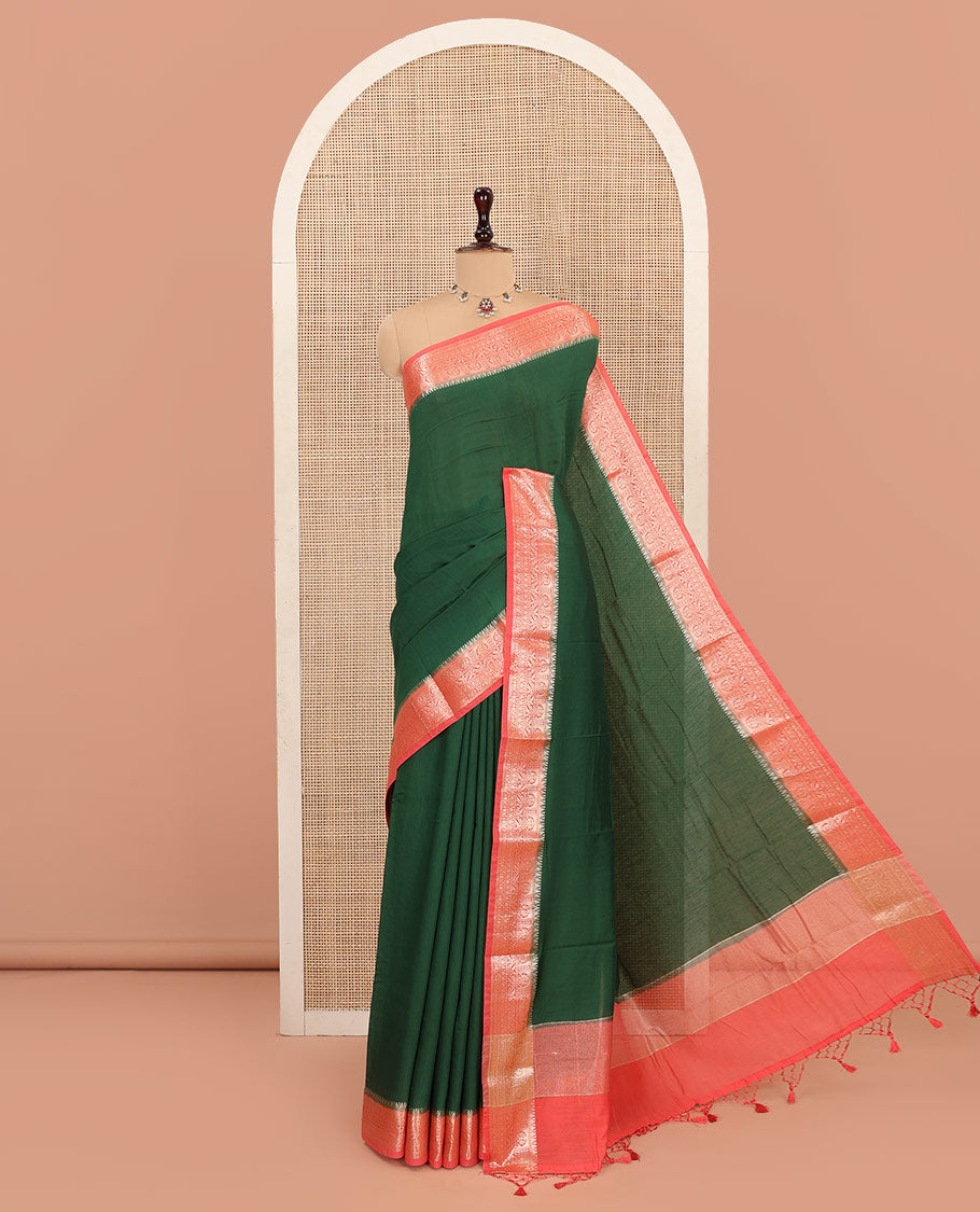 Green Plain Assam Silk Saree, Complemented by Captivating Contrast Border Featuring Traditional Zari Designs, Gleaming Zari Woven Pallu, and Paired with a Contrast Blouse