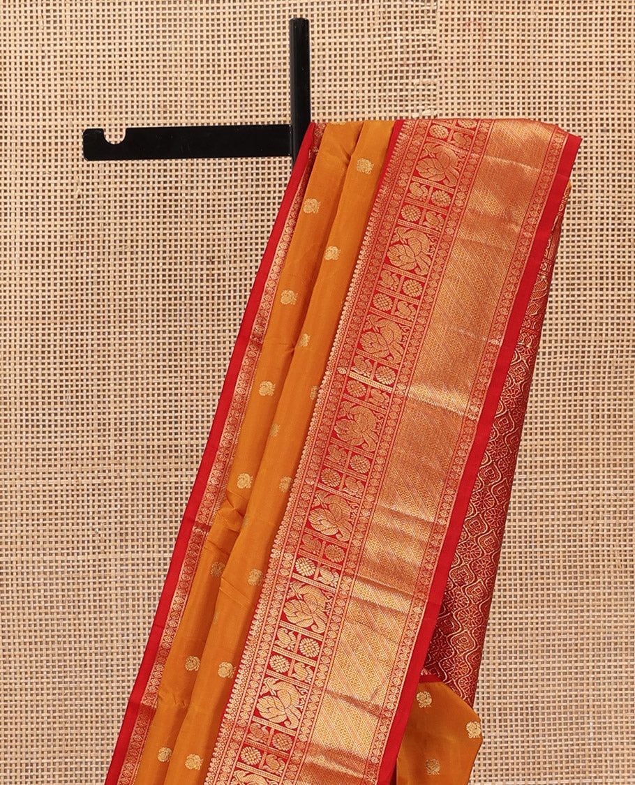 Orange peacock zari buttas Bangalore silk saree, contrast traditional zari border, and pallu of ogee patterns