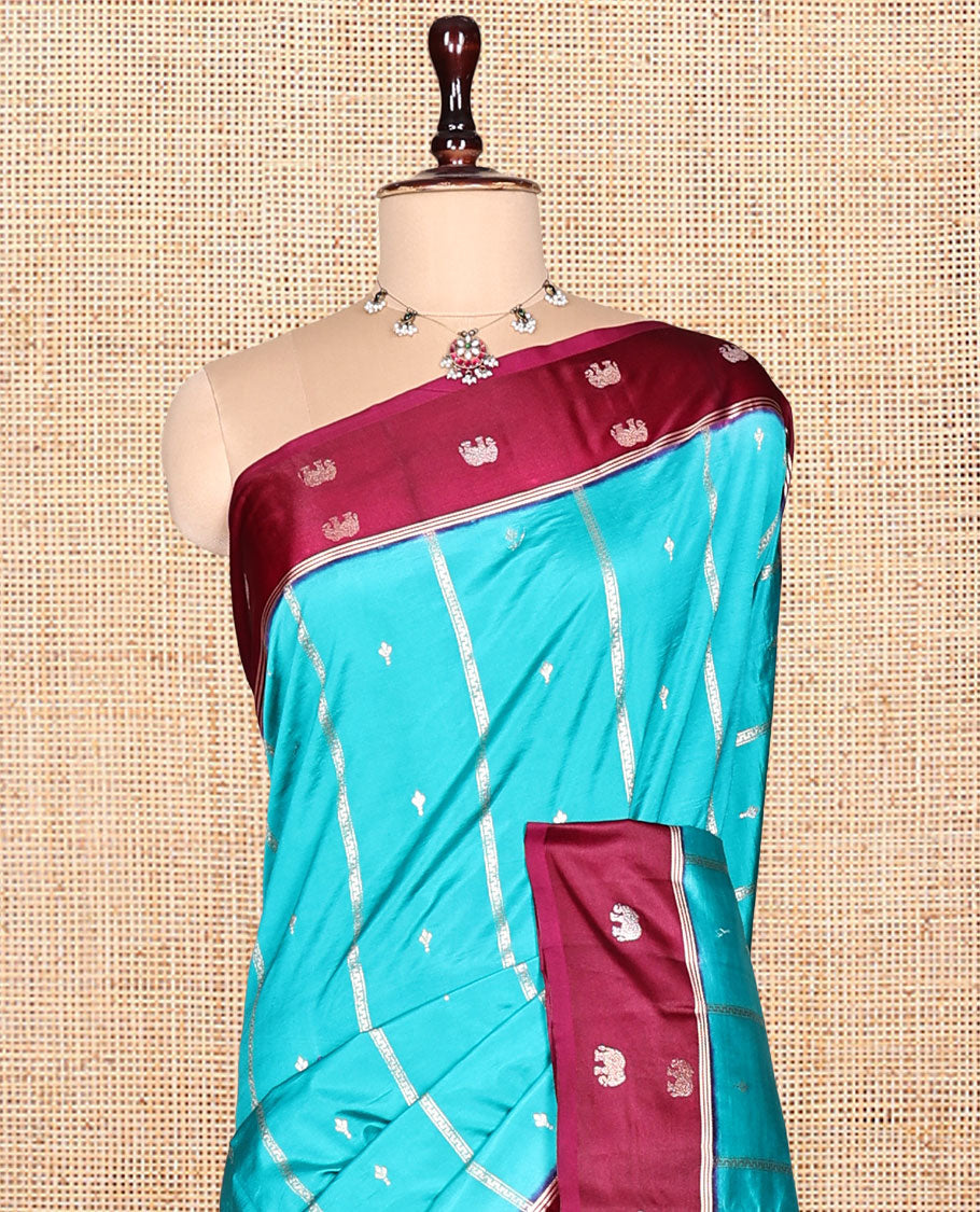 Blue Satin Silk Saree, Adorned with Buttas and Stripes, Complemented by a Contrast Elephant Motif Border, Grand Jaal Pallu, and a Contrast Blouse
