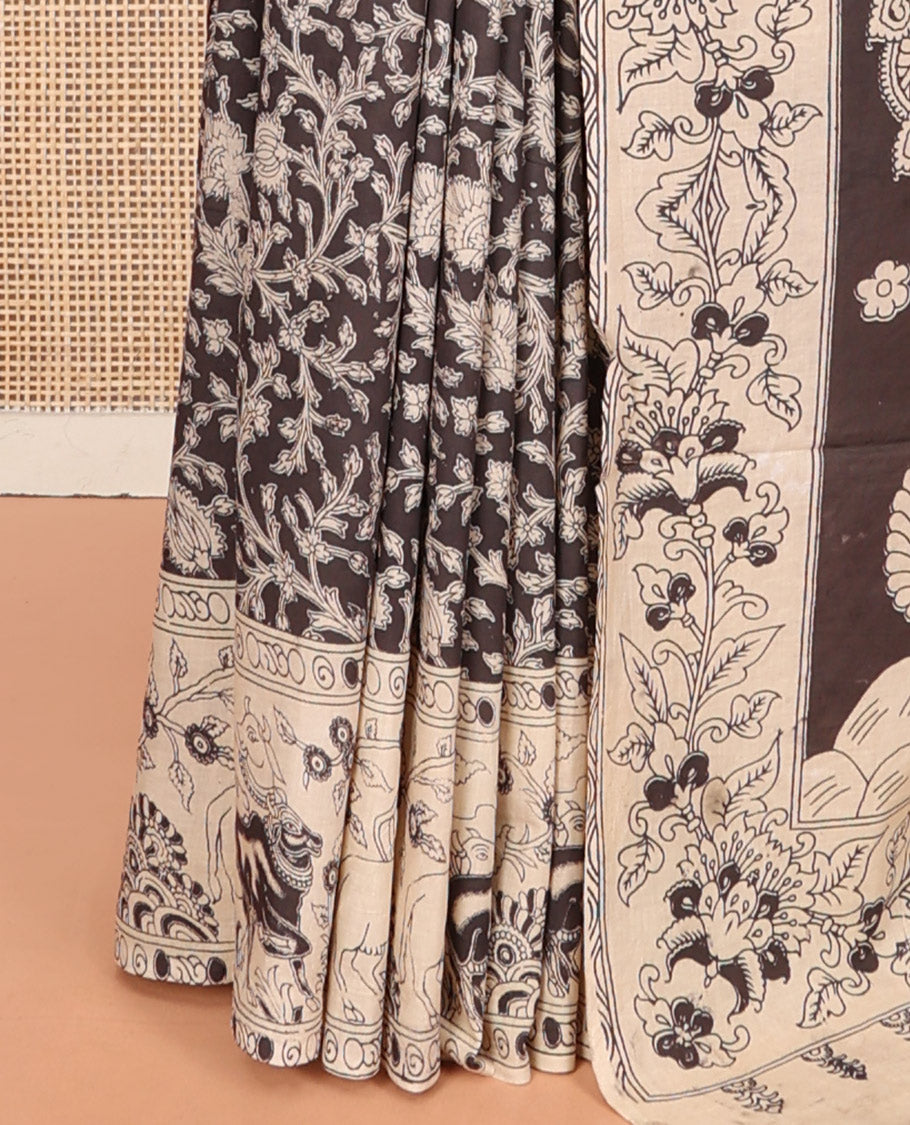Black Machine Printed Kalamkari Cotton Saree Features a Floral Vine, Contrast Pichwai-Printed Border, Peacock-Printed Pallu, and a Matching Blouse