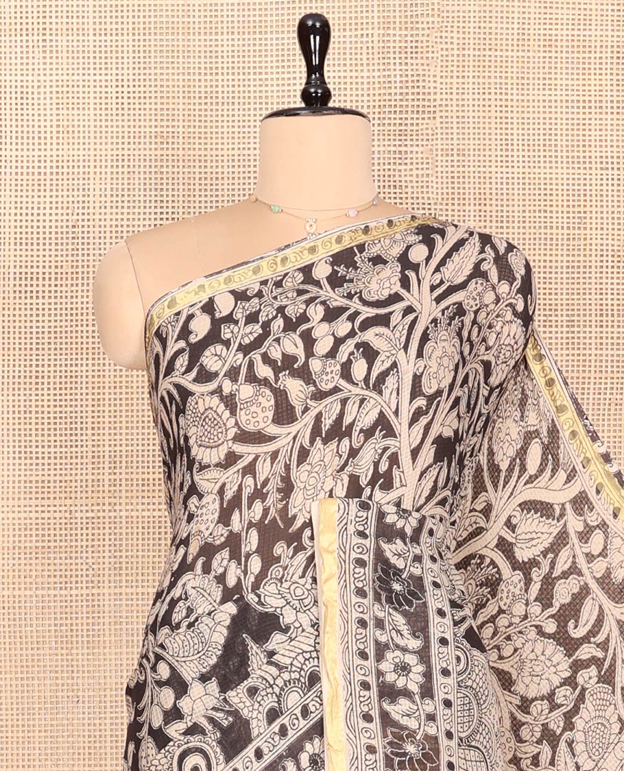Black Machine-Printed Kalamkari Cotton Saree Features Floral Vine and Pichwai Cow, a Piping Border, Kalamkari Peacock Pallu, and a Matching Blouse