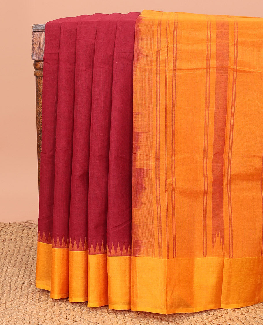 Maroon Plain Kanchi Cotton Saree, Complemented by a Contrast Temple Border, Subtly Striped Pallu, and Paired with a Contrast Blouse