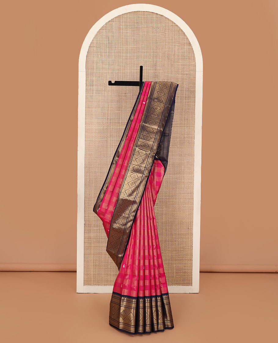 Pink zari buttas and checked Kanchipuram silk saree, contrast border of thazampoo rekku, kathir, mayil kann, and jaal designs