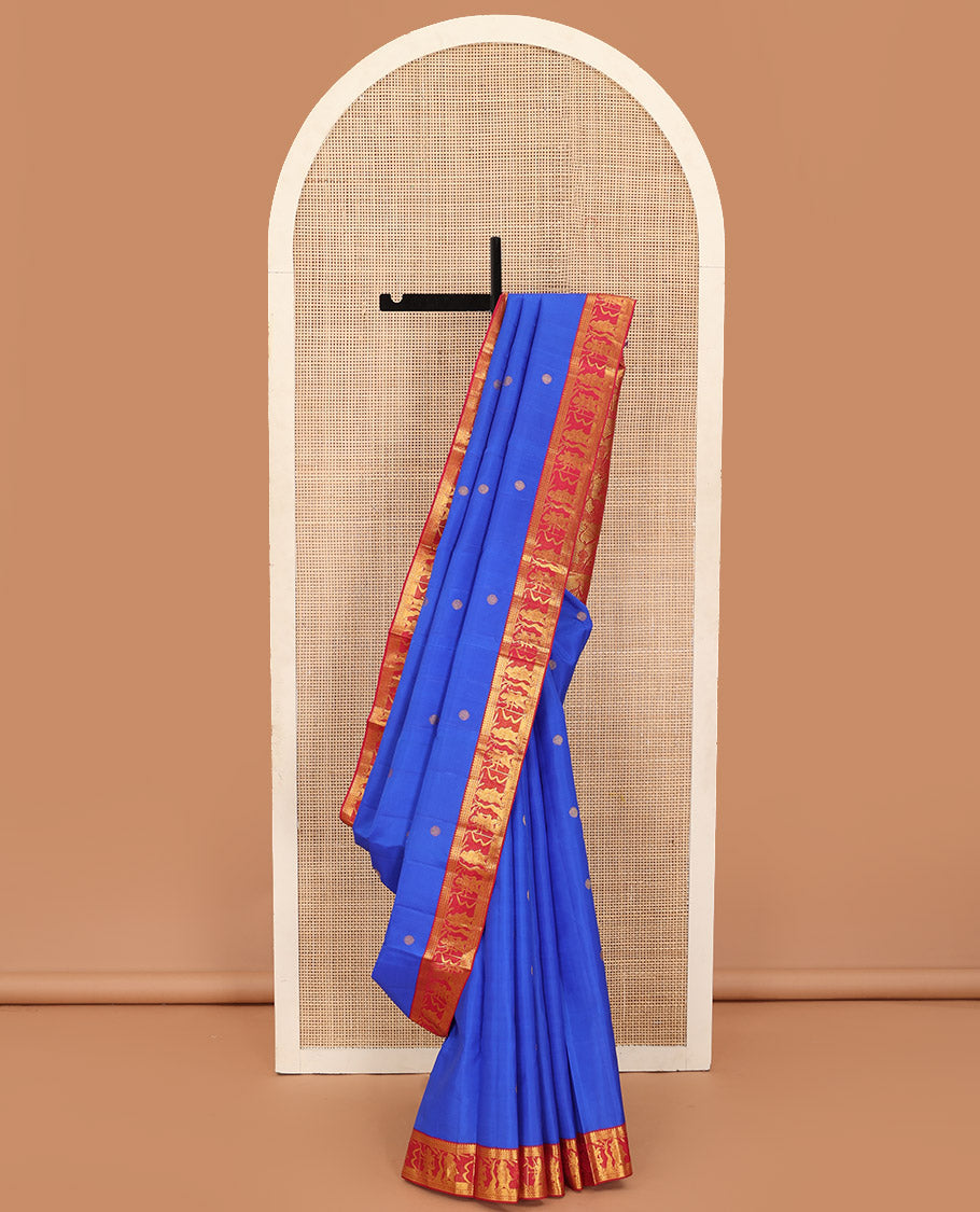 Royal blue chakram buttas Kanchipuram silk saree, contrast border of thilakam mokku,kathir, and Mythological characters, and pallu of Mythological motifs