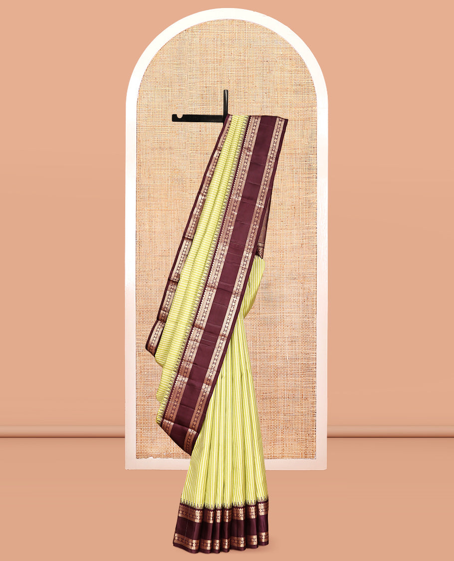 Green Vasundhara Silk Saree, Adorned with Kasa-Kasa-Style Checks, Complemented by a Contrast Rettai Pettu Border of Thazampoo Rekku, Salngai, Banaras, Kathir, Kamalam, and Star Designs, Gleaming Zari-Decked-Up Pallu and Paired with a Contrast Blouse