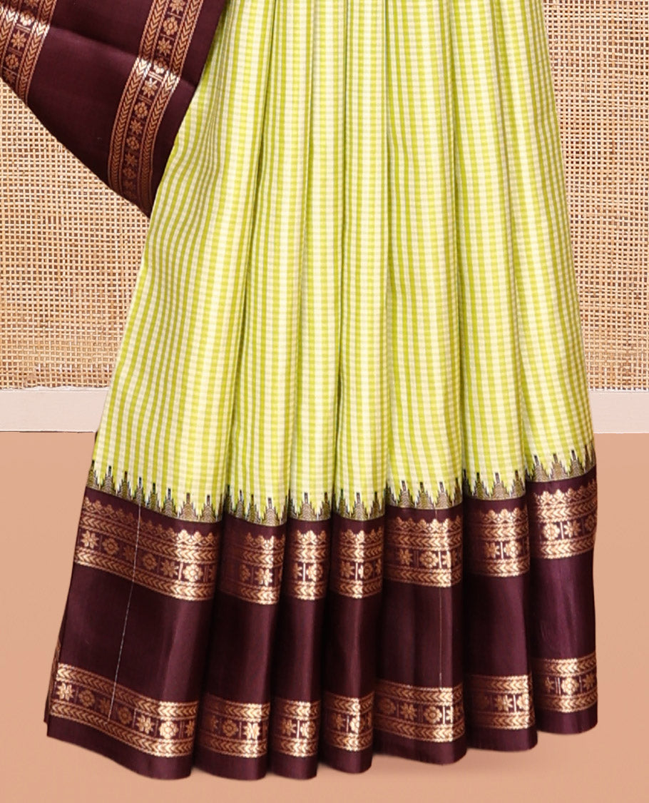 Green Vasundhara Silk Saree, Adorned with Kasa-Kasa-Style Checks, Complemented by a Contrast Rettai Pettu Border of Thazampoo Rekku, Salngai, Banaras, Kathir, Kamalam, and Star Designs, Gleaming Zari-Decked-Up Pallu and Paired with a Contrast Blouse