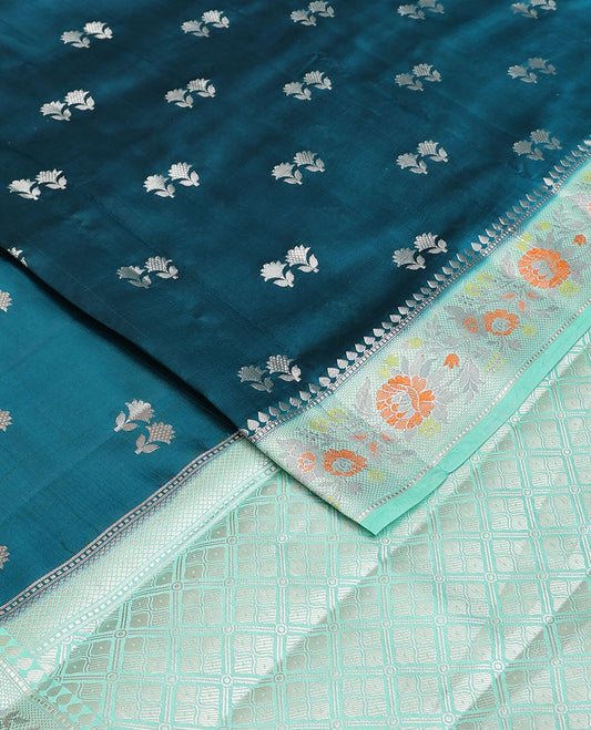 Blue raw mango silk saree with floral zari buttas, contrast border of meenakari zari floral designs & jaal pallu