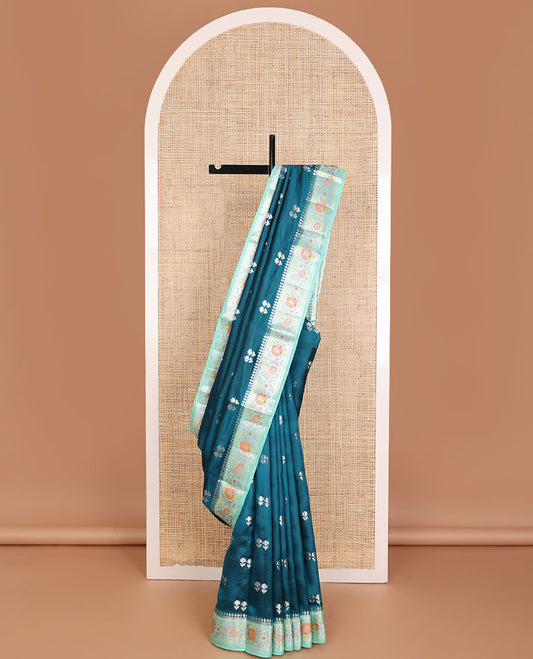 Blue raw mango silk saree with floral zari buttas, contrast border of meenakari zari floral designs & jaal pallu