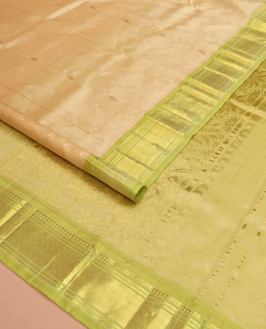 Sandal zari buttas Kanchipuram silk saree, contrast one-sided border of paneer sombu, banaras, and jaal designs, and pallu of floral designs