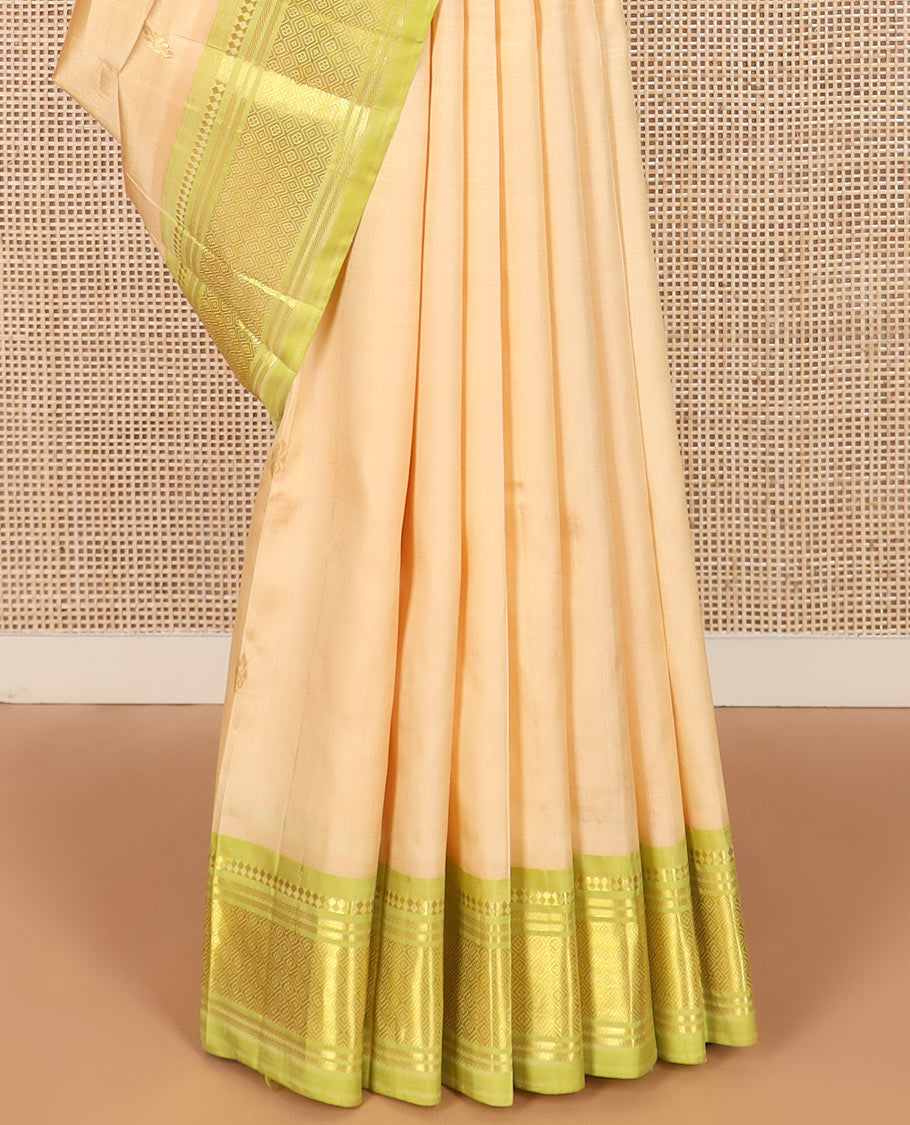 Sandal zari buttas Kanchipuram silk saree, contrast one-sided border of paneer sombu, banaras, and jaal designs, and pallu of floral designs