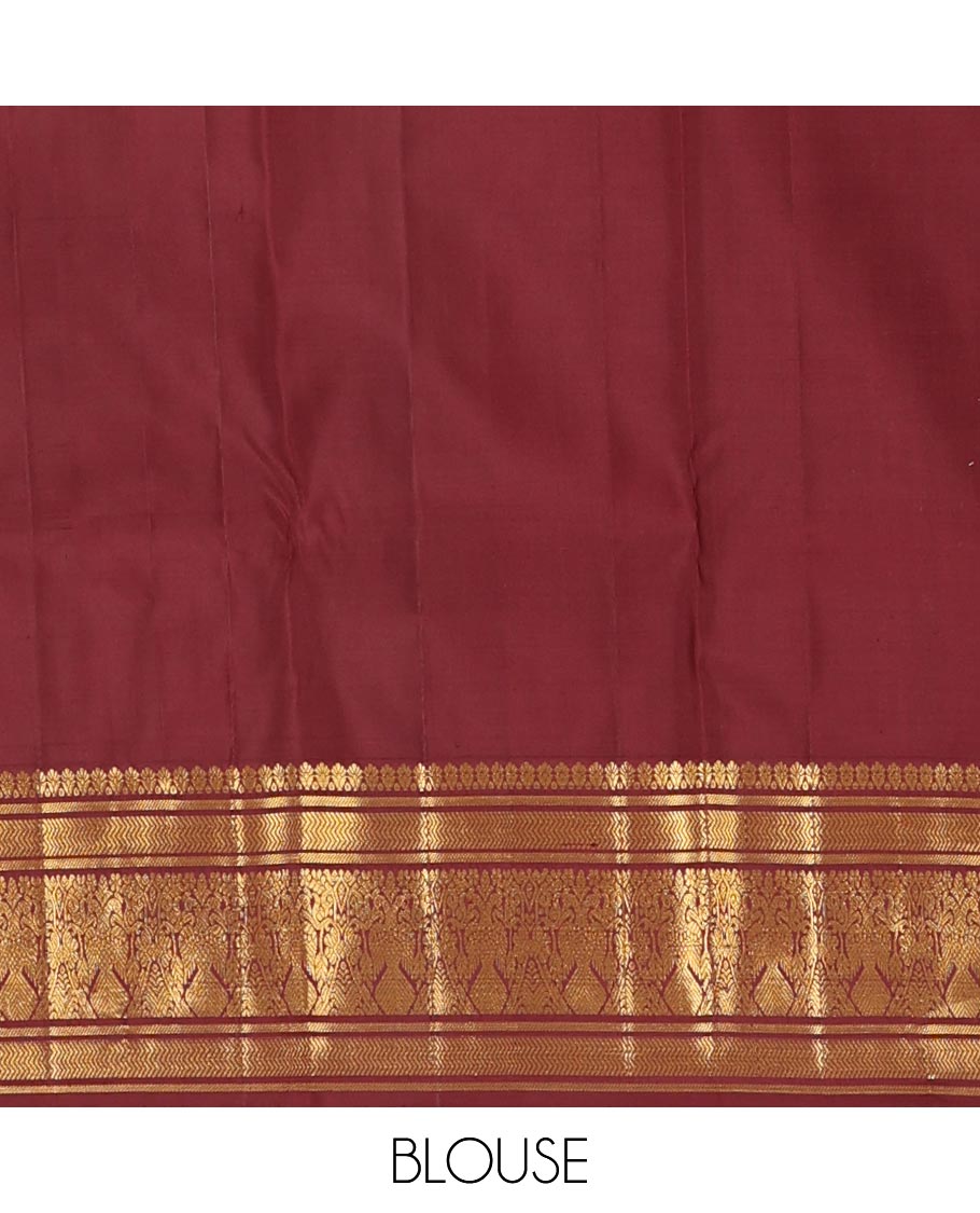 Maroon chakram buttas Kanchipuram silk saree, zari border of banaras,vanki & iru thalai pakshi & pallu of kathir,kamalam,mayil,yaanai,manga & iruthalai pakshi