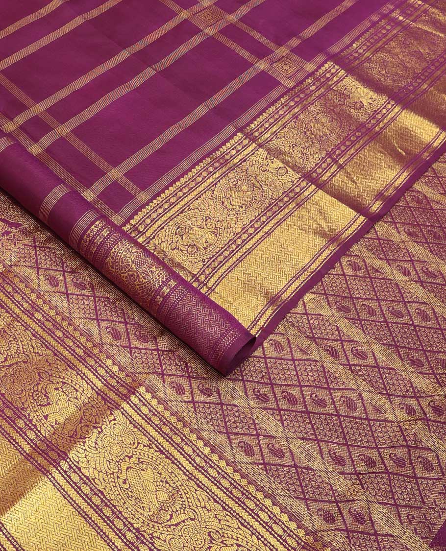 Purple buttas and checked Kanchipuram silksaree,border of thilakam mokku,muthu,rudraksham,kathir,mayil, and paimadi kattam and jaal pallu