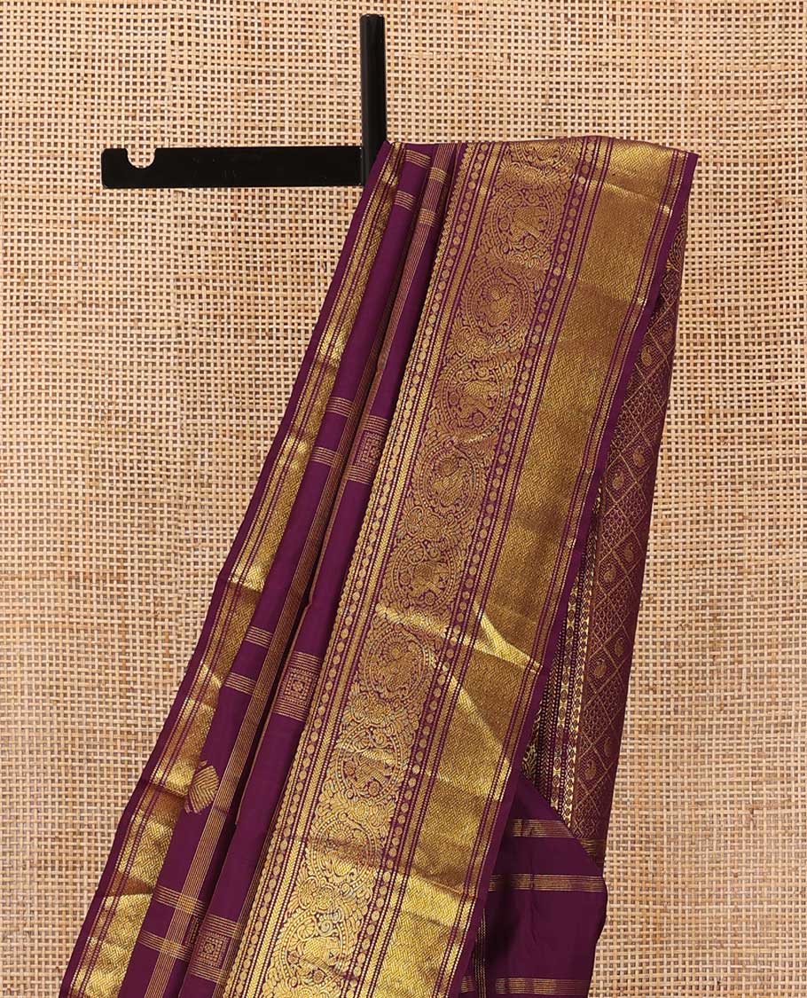 Purple buttas and checked Kanchipuram silksaree,border of thilakam mokku,muthu,rudraksham,kathir,mayil, and paimadi kattam and jaal pallu
