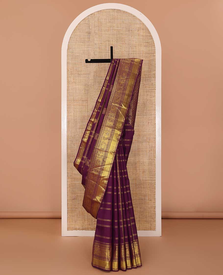 Purple buttas and checked Kanchipuram silksaree,border of thilakam mokku,muthu,rudraksham,kathir,mayil, and paimadi kattam and jaal pallu