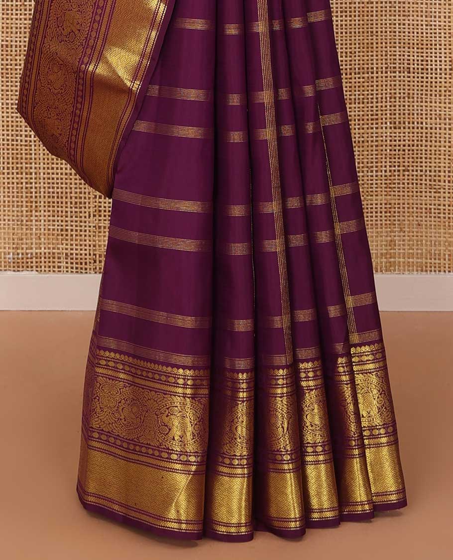 Purple buttas and checked Kanchipuram silksaree,border of thilakam mokku,muthu,rudraksham,kathir,mayil, and paimadi kattam and jaal pallu