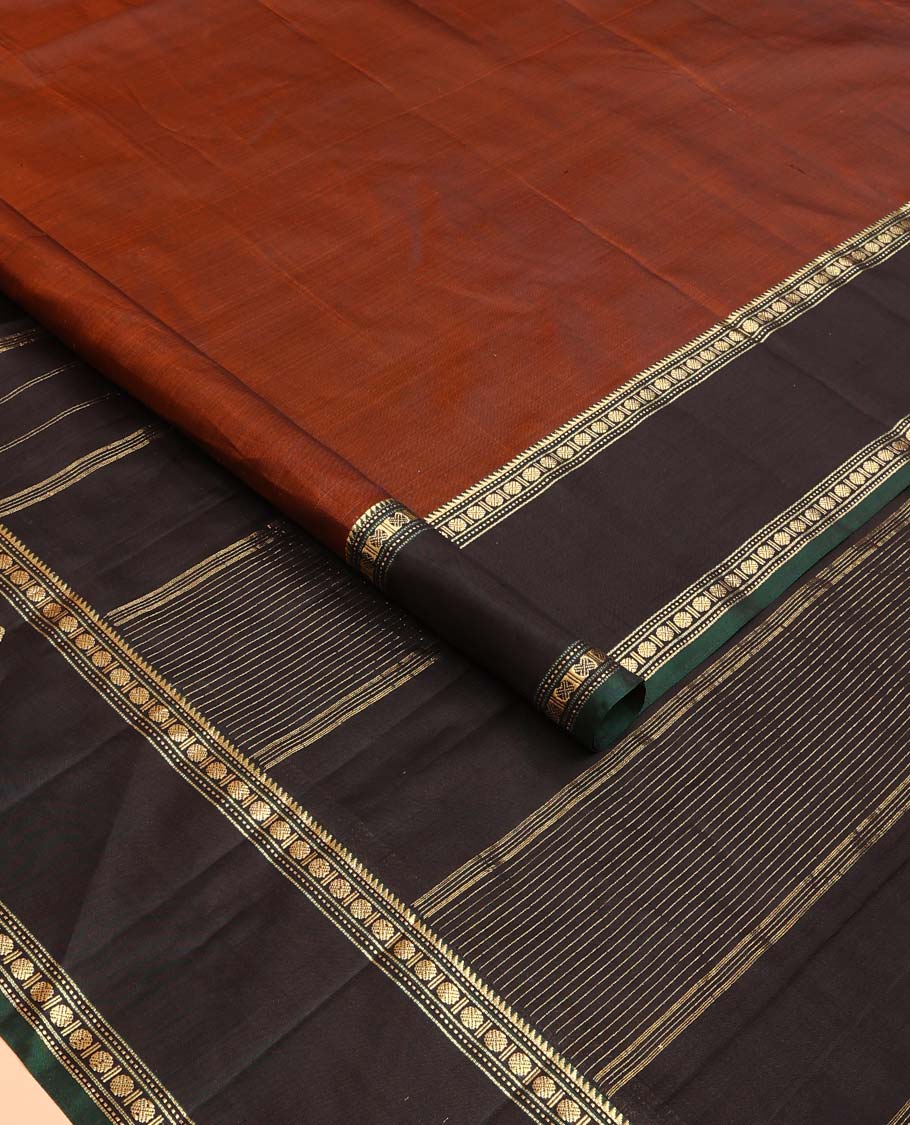 Rust plain Kanchipuram silk saree, contrast border of rekku, muthu, rudraksham and mayil, and zari striped pallu