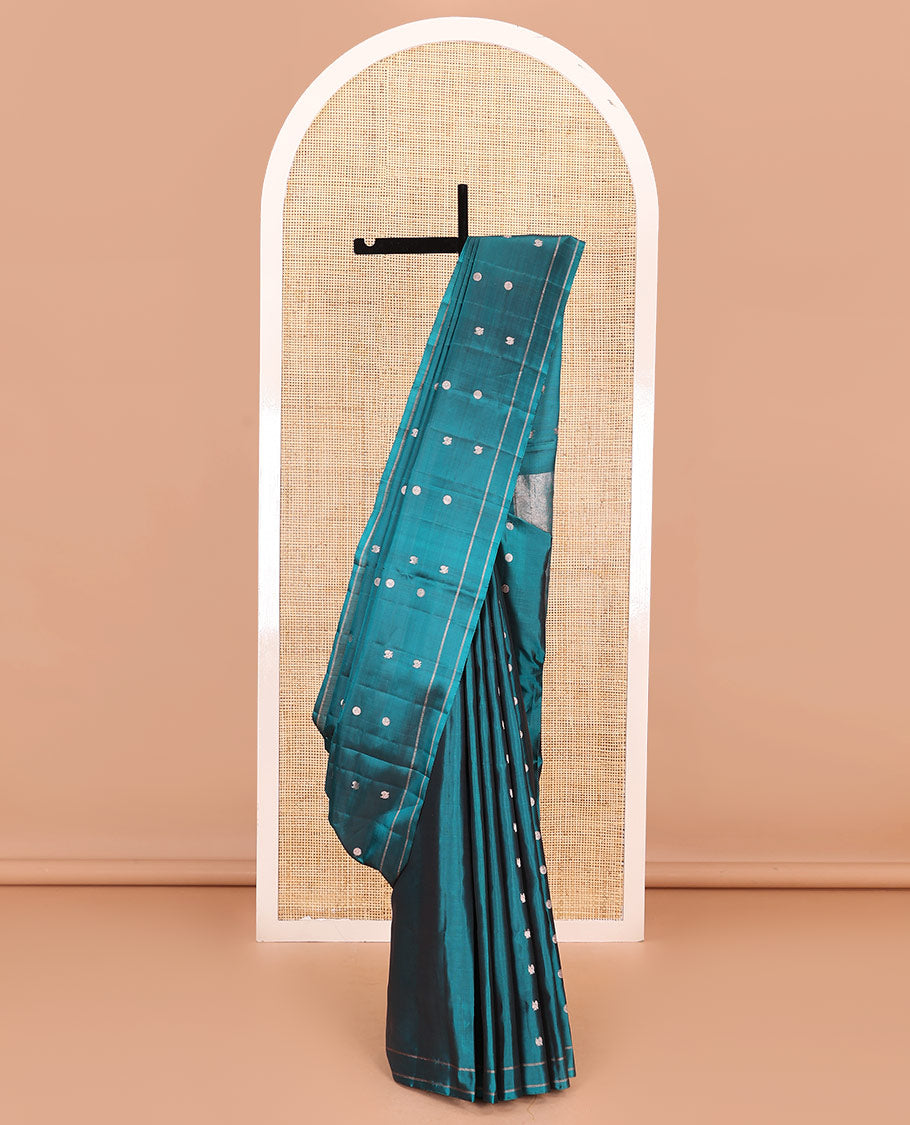 Peacock blue annam chakram buttas soft silk saree, zari piping border, and zari striped pallu
