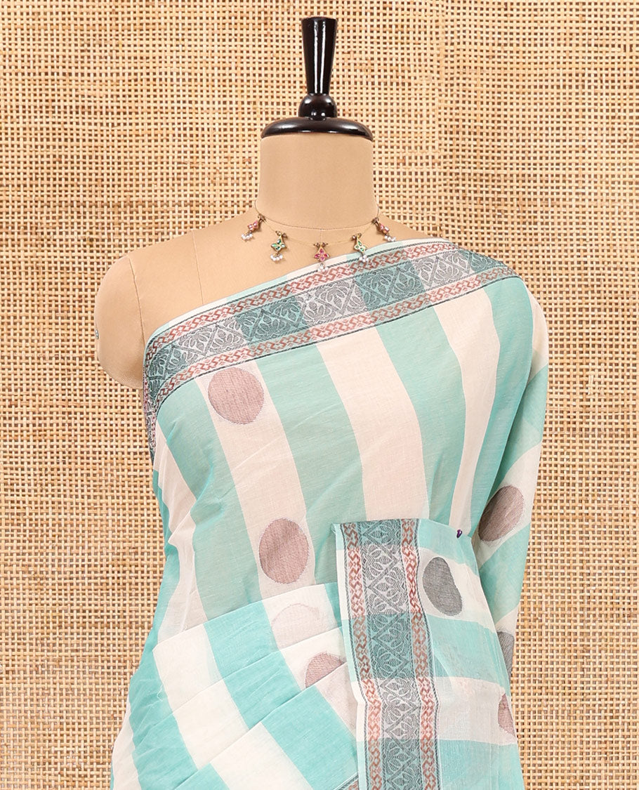 Sea green striped and polka thread dotted woven nagama cotton saree , traditional thread border, pallu of floral and leaf design, and plain blouse