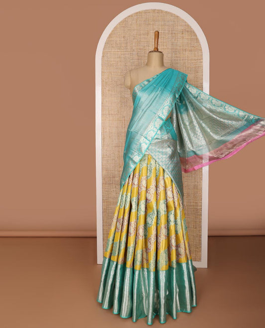 Green floral design silk half saree with contrast border of rekku, paun, muthu, banaras design, zari design blouse & floral design dhavani