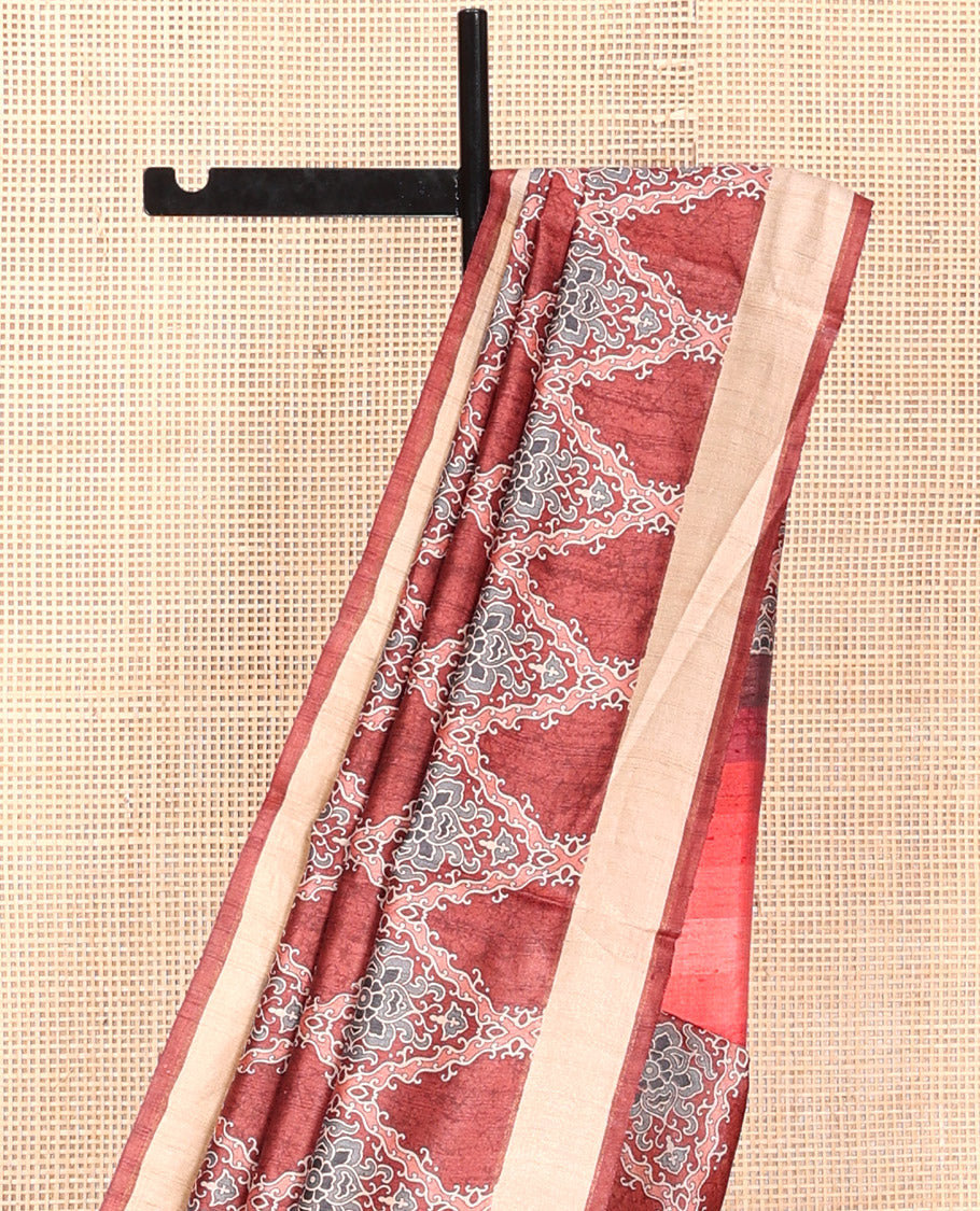 Terracotta Red Tussar Silk Saree, Boldly Accentuated with Ajrakh-Style Jaal Design on Its Body, a Subtle Border, Ombre-Style Striped Pallu, and Paired with a Contrast Blouse
