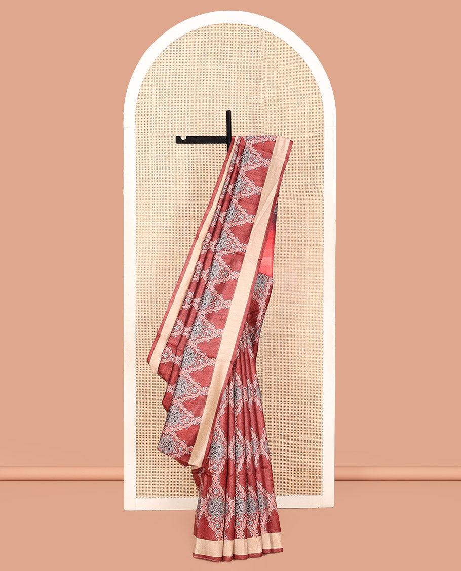 Terracotta Red Tussar Silk Saree, Boldly Accentuated with Ajrakh-Style Jaal Design on Its Body, a Subtle Border, Ombre-Style Striped Pallu, and Paired with a Contrast Blouse