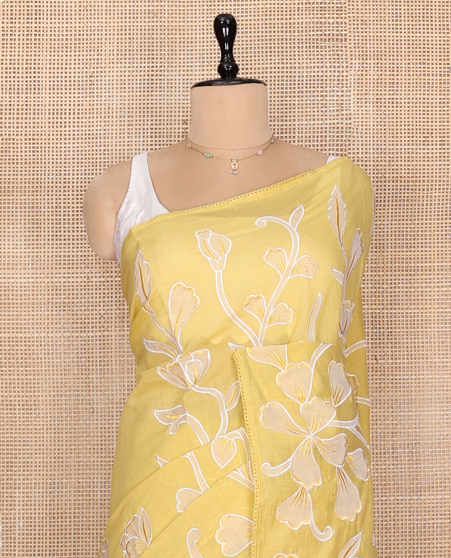 Yellow Fancy Tussar Saree, Artfully Detailed with Floral Vine Embroidery, a Subtle Scallop Border, and a Matching Blouse