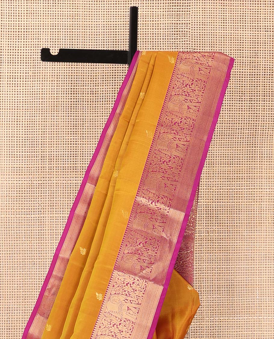 Orange zari buttas Vasundhara silk mix saree, contrast border of thilakam mokku, yaanai, kathir, and zari designs, and intricate pallu