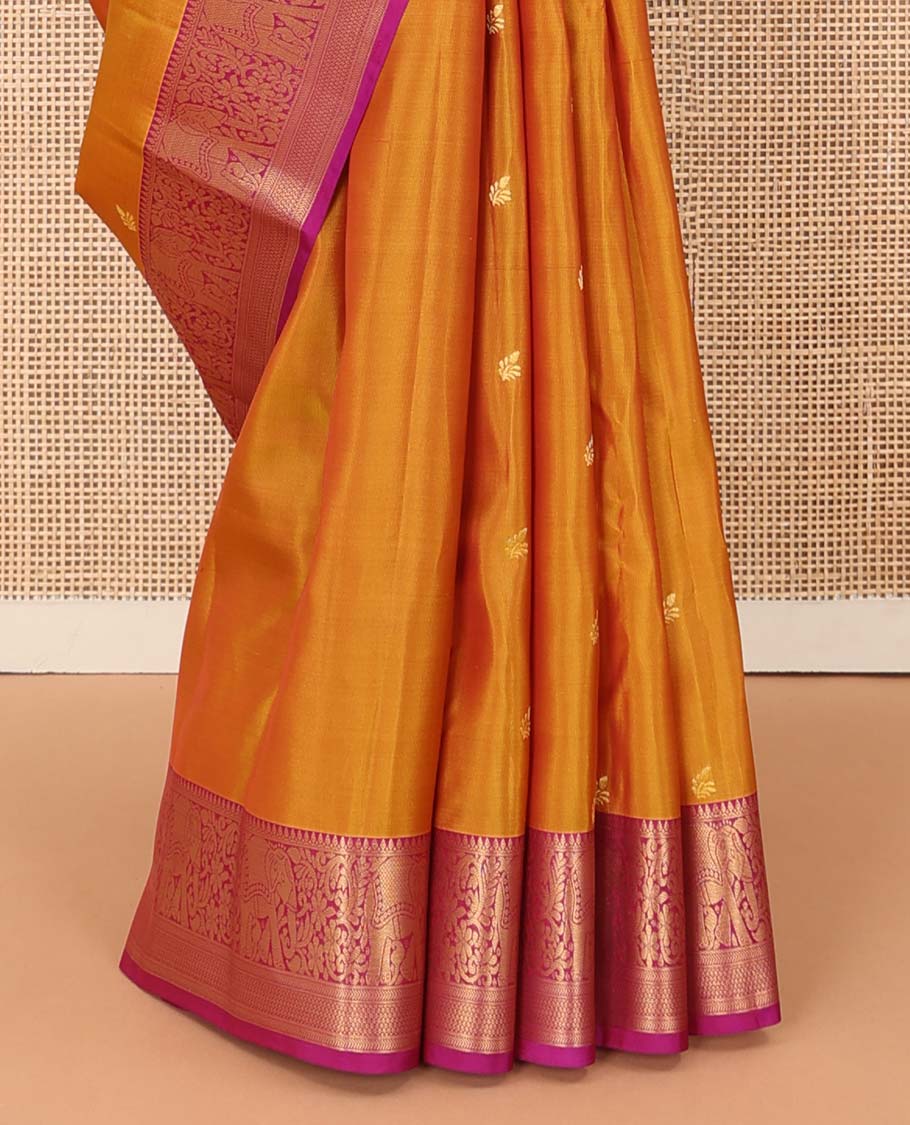 Orange zari buttas Vasundhara silk mix saree, contrast border of thilakam mokku, yaanai, kathir, and zari designs, and intricate pallu