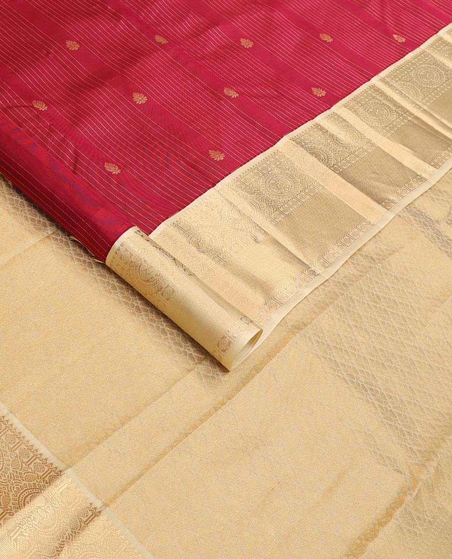 Red stripes, and buttas Vasundhara silk mix saree, contrast border of rekku, muthu, rudraksham, and round mayil designs, and jaal pallu