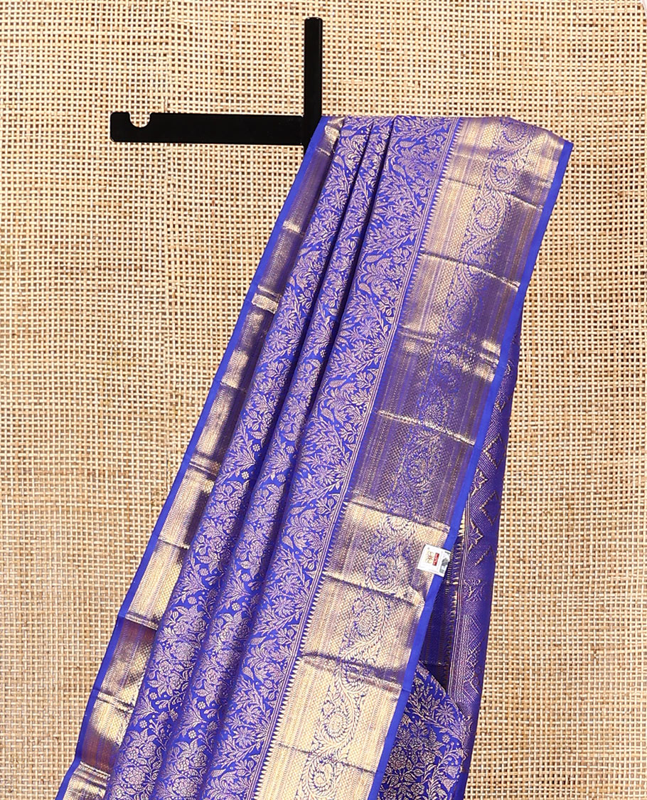 Royal blue jacquard kanchipuram silk saree, zari border of thazampoo rekku, muthu, kathir, kuyil kann, and dhavana kodi designs, and intricate pallu