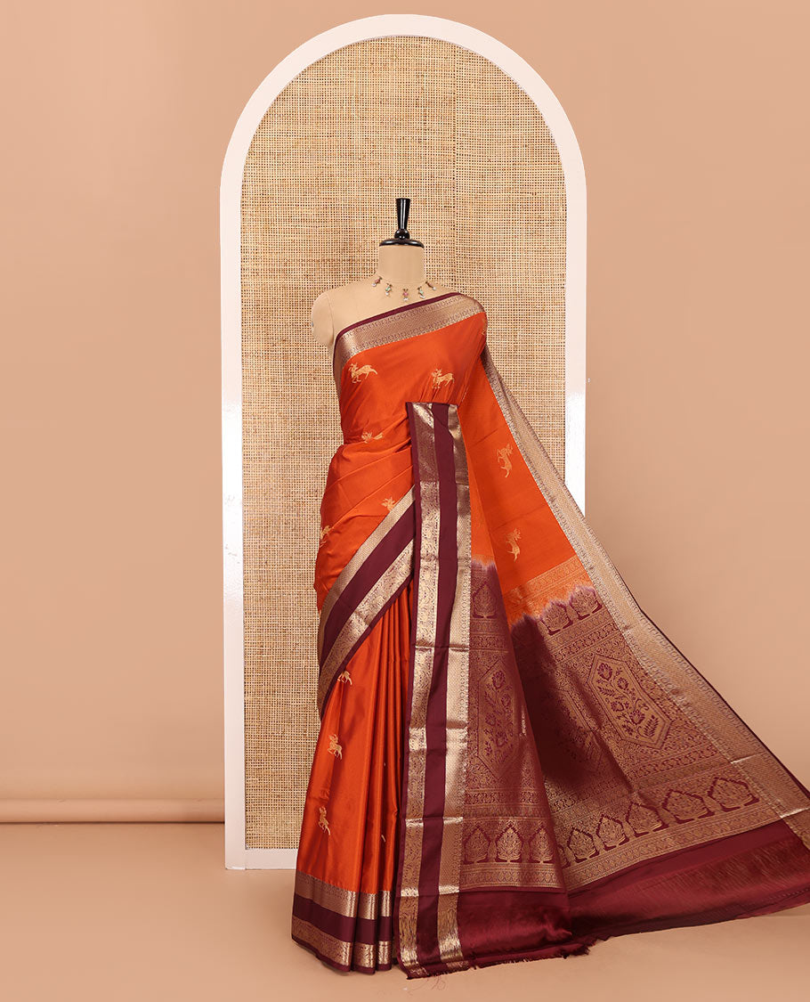 Orange deer motifs zari woven kanchi soft silk saree, contrast traditional zari design rettai pettu border, pallu of Mughal-style floral designs, and contrast plain blouse