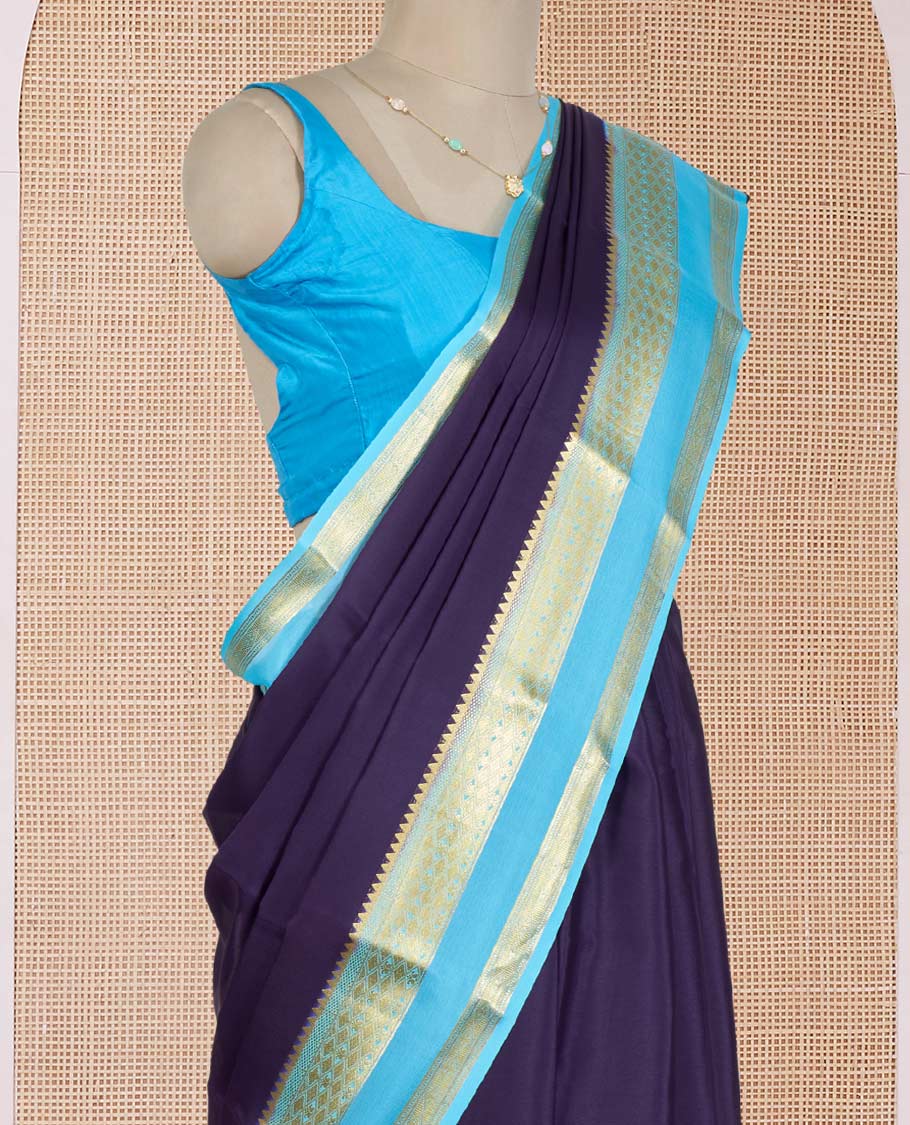 Navy Blue Plain Mysore Silk Saree, Delicately Woven by a Contrast Rettai Pettu Border of Traditional Zari Designs, a Subtly Sparkled Pallu of Zari Stripes, and a Contrast Blouse