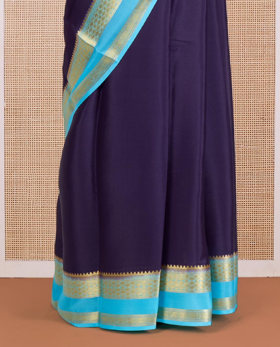 Navy Blue Plain Mysore Silk Saree, Delicately Woven by a Contrast Rettai Pettu Border of Traditional Zari Designs, a Subtly Sparkled Pallu of Zari Stripes, and a Contrast Blouse