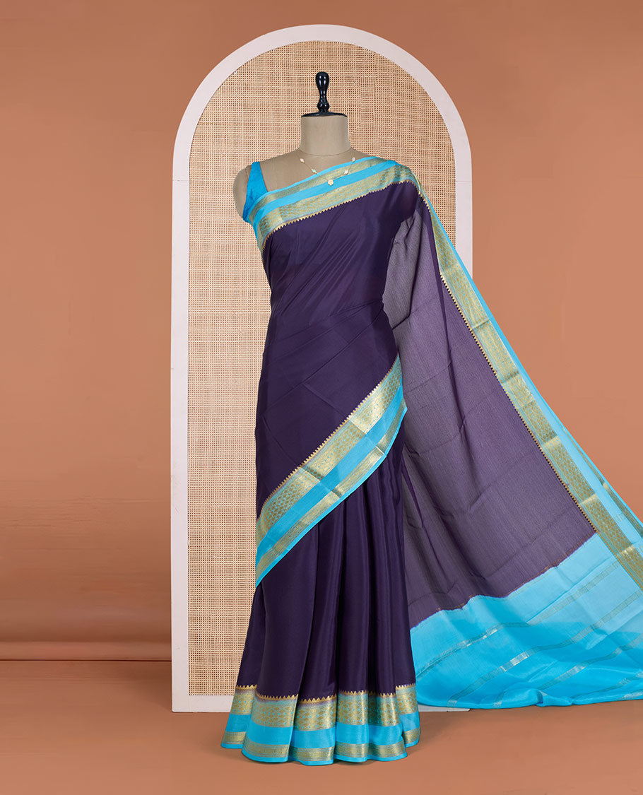 Navy Blue Plain Mysore Silk Saree, Delicately Woven by a Contrast Rettai Pettu Border of Traditional Zari Designs, a Subtly Sparkled Pallu of Zari Stripes, and a Contrast Blouse