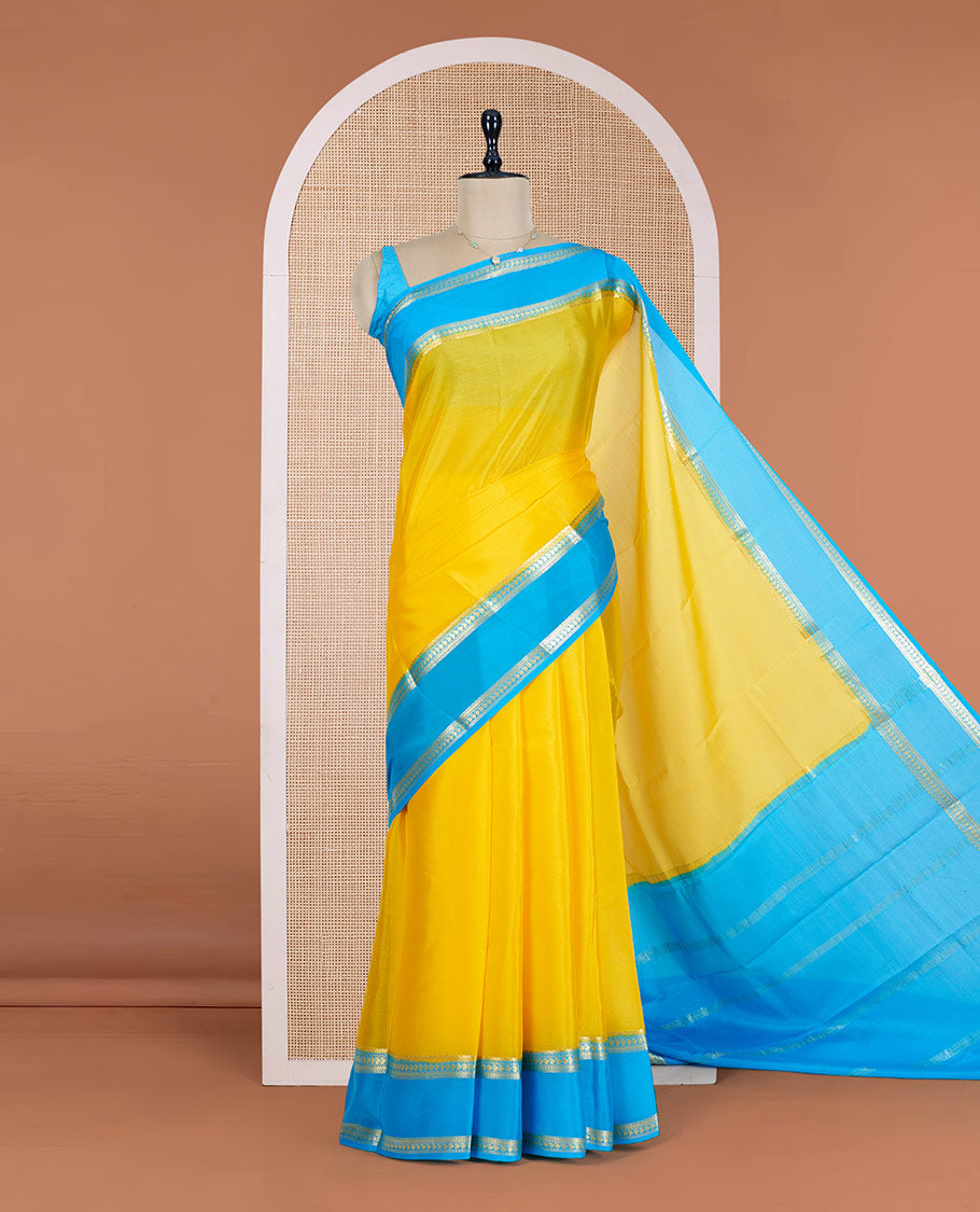 Yellow Plain Mysore Silk Saree, Complemented by a Contrast Rettai Pettu Border of Traditional Zari Designs, a Subtly Sparkled Pallu of Zari Stripes, and a Contrast Blouse