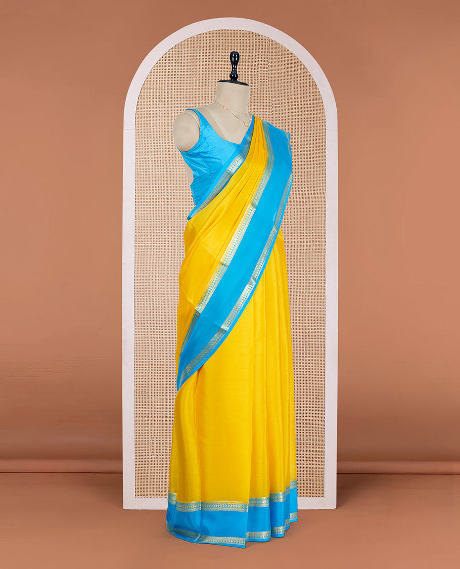 Yellow Plain Mysore Silk Saree, Complemented by a Contrast Rettai Pettu Border of Traditional Zari Designs, a Subtly Sparkled Pallu of Zari Stripes, and a Contrast Blouse