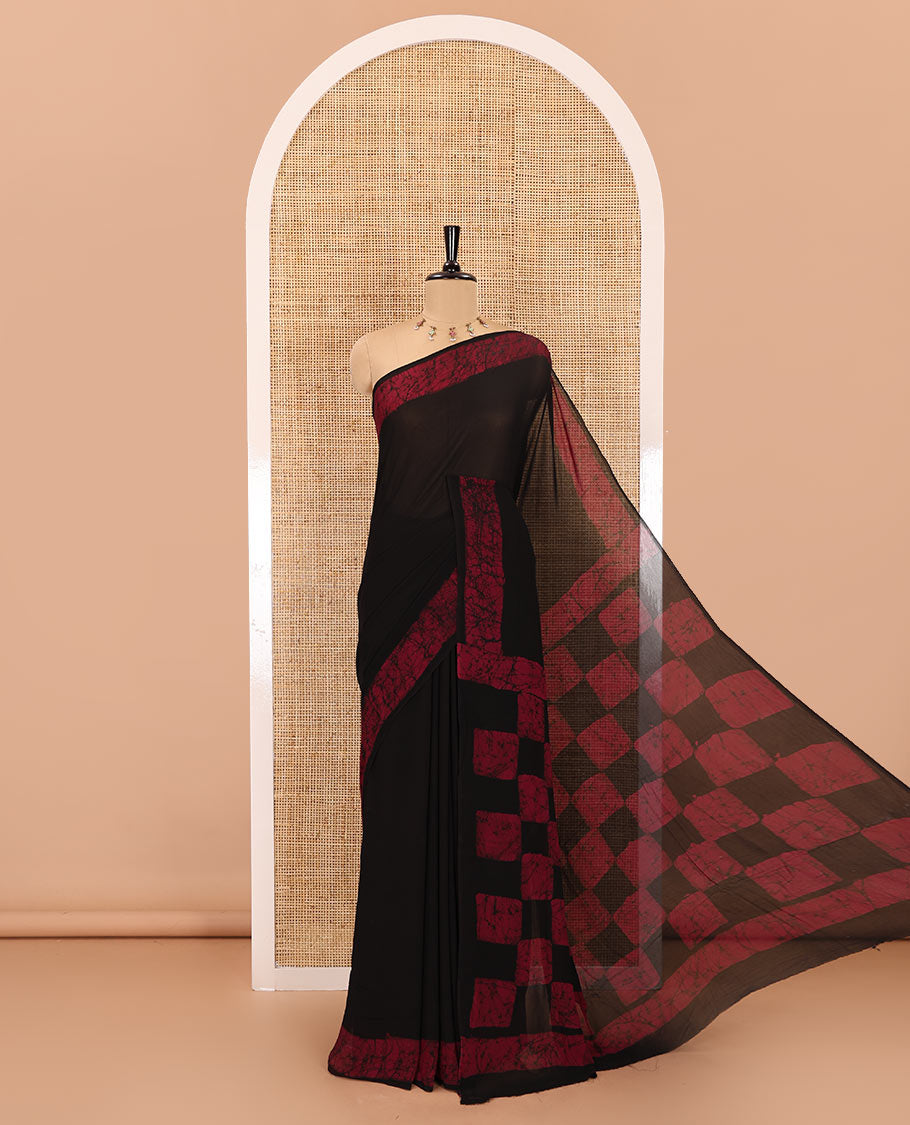 Black and purple plain georgette saree, batik printed border, batik printed checked pallu, and a matching blouse