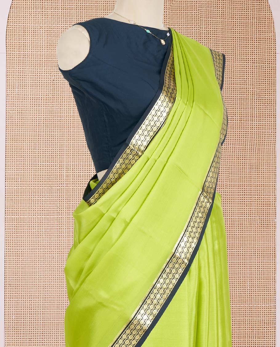 Parrot Green Plain Mysore Silk Saree, Complemented by a Contrast Zari Border of Traditional Designs, a Pallu Gleamed Up with Zari Stripes, and a Contrast Blouse