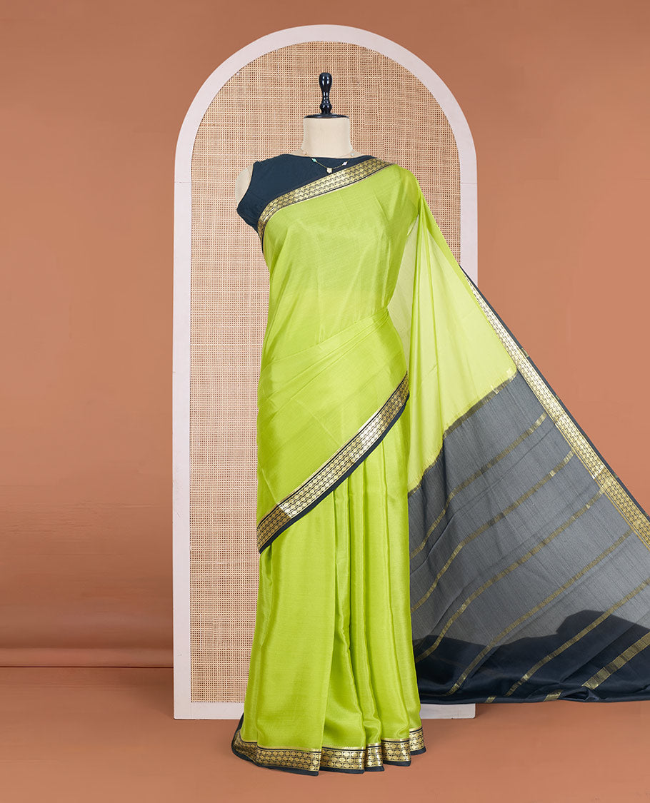 Parrot Green Plain Mysore Silk Saree, Complemented by a Contrast Zari Border of Traditional Designs, a Pallu Gleamed Up with Zari Stripes, and a Contrast Blouse
